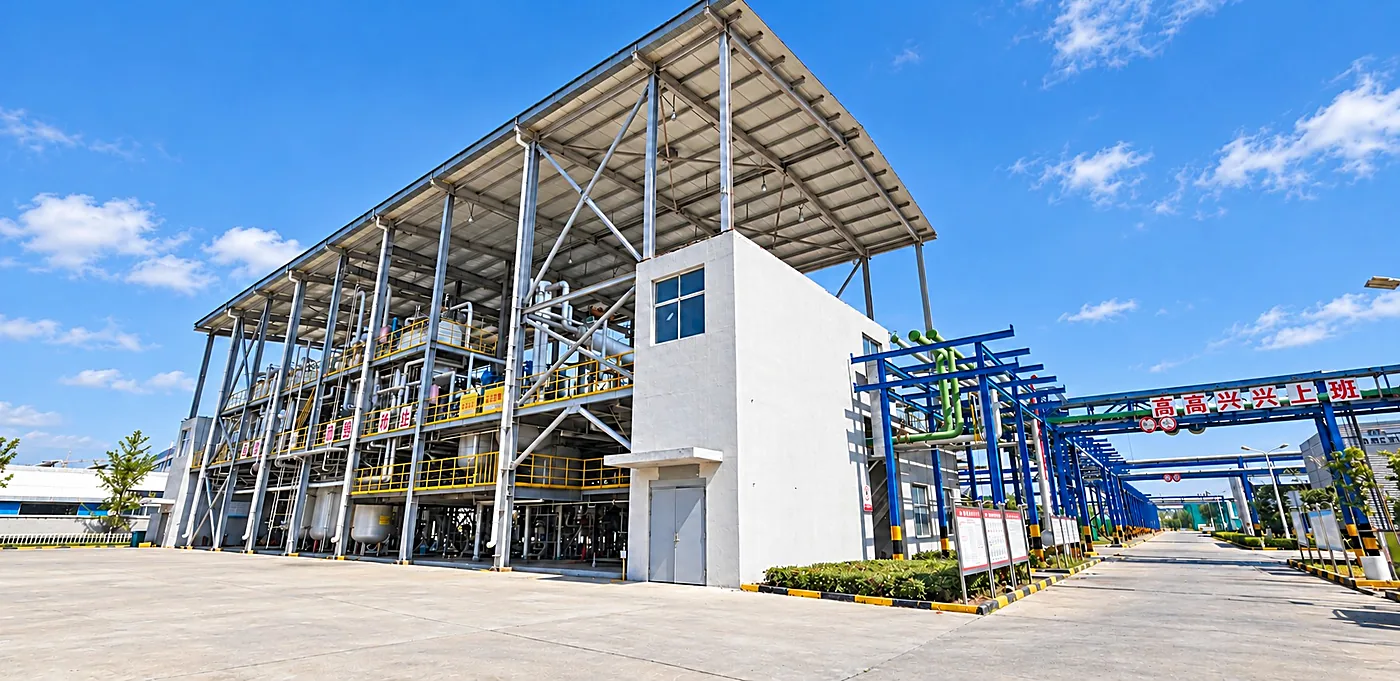 Stainless steel reactor train and overhead pipe rack at the DECHEM manufacturing base